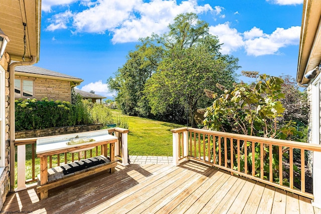 wooden deck with a yard