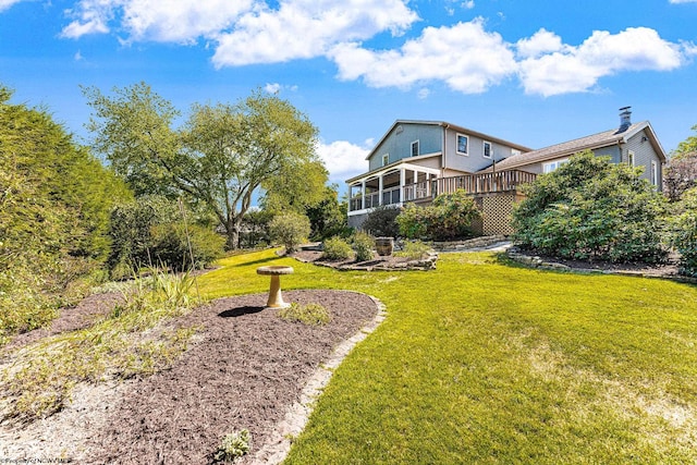 view of yard featuring a wooden deck