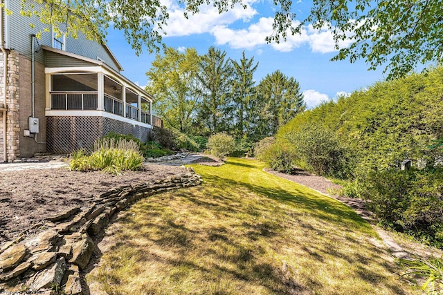 view of yard with a sunroom