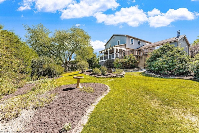 view of yard with a sunroom