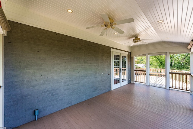 wooden terrace featuring ceiling fan and french doors