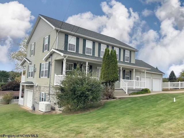 view of front of home with a porch, a garage, central AC unit, and a front lawn