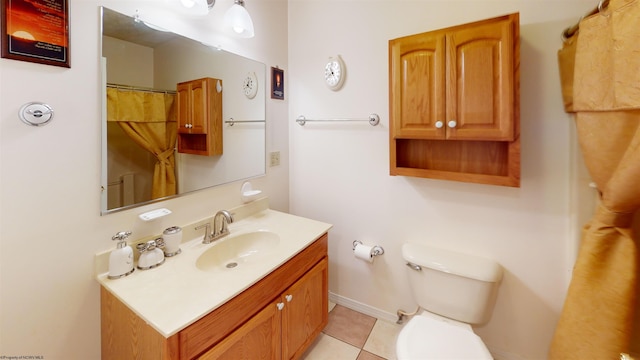 bathroom featuring vanity, toilet, and tile patterned floors