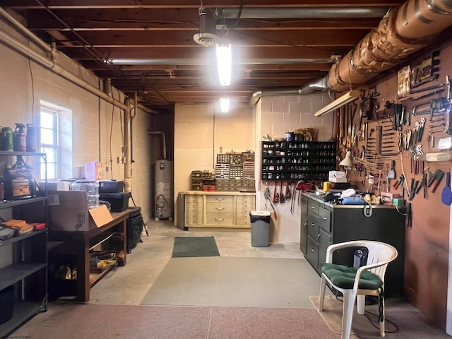 basement featuring water heater and a workshop area