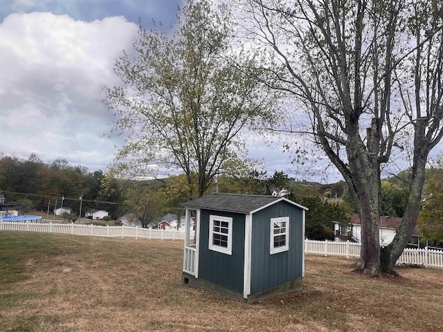 view of outbuilding with a lawn