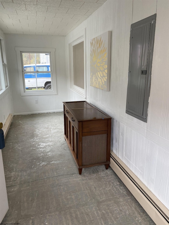 hallway featuring baseboard heating and electric panel