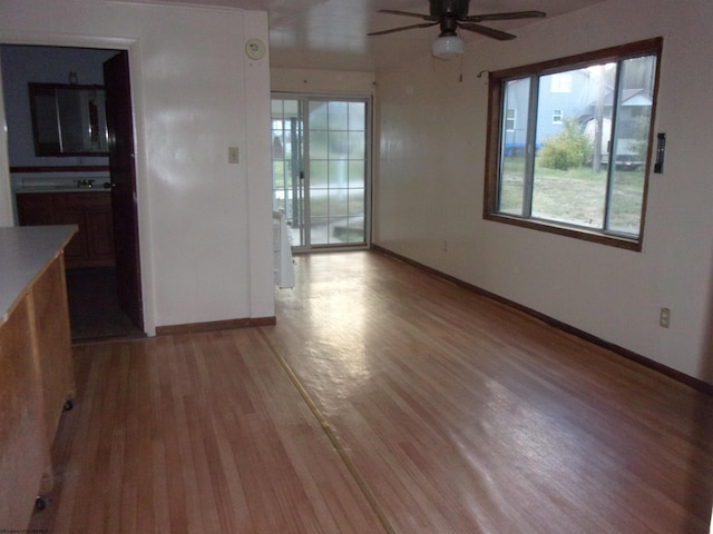 empty room featuring light hardwood / wood-style floors and ceiling fan