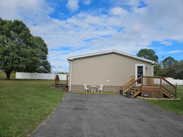 view of property exterior with a lawn