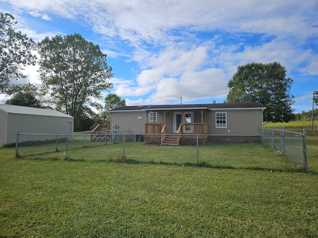 rear view of property featuring a yard