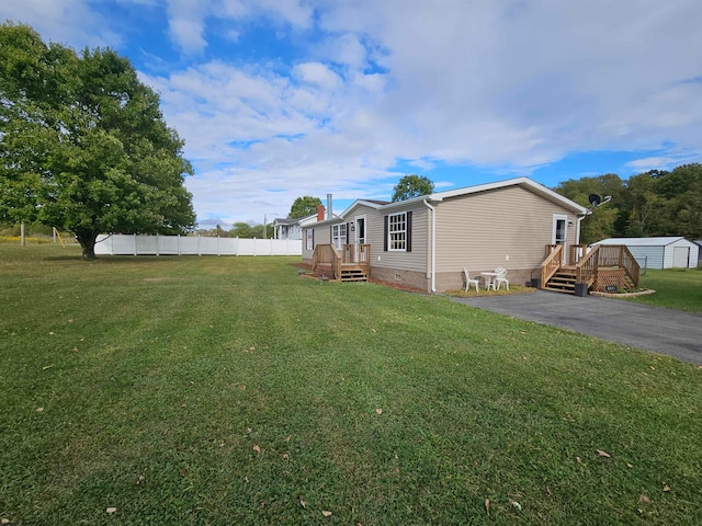 view of yard featuring a wooden deck