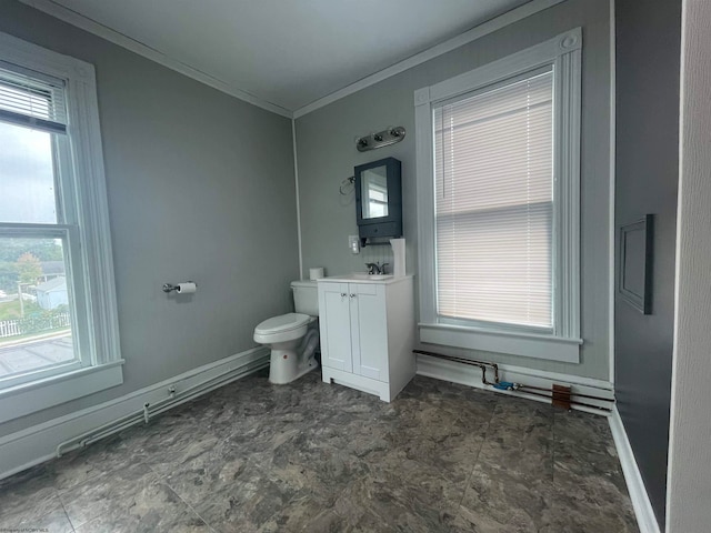 bathroom featuring vanity, crown molding, and toilet