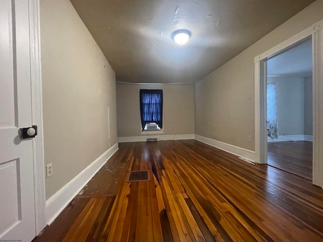 spare room with dark hardwood / wood-style floors