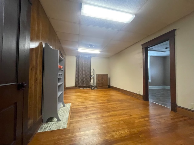 interior space featuring light hardwood / wood-style flooring and a paneled ceiling