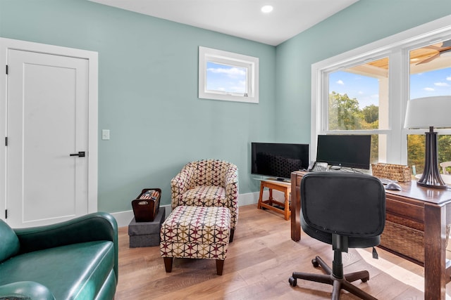 home office featuring a healthy amount of sunlight and light hardwood / wood-style floors