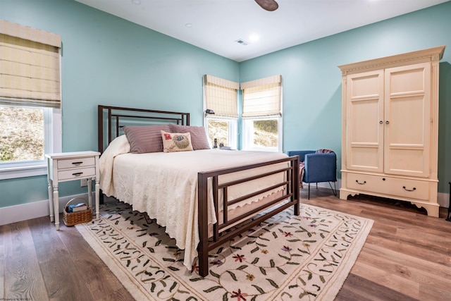 bedroom featuring ceiling fan and hardwood / wood-style flooring