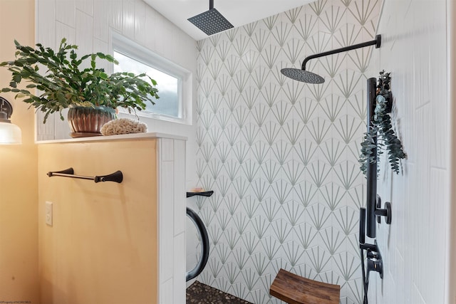 bathroom with tile walls and tiled shower