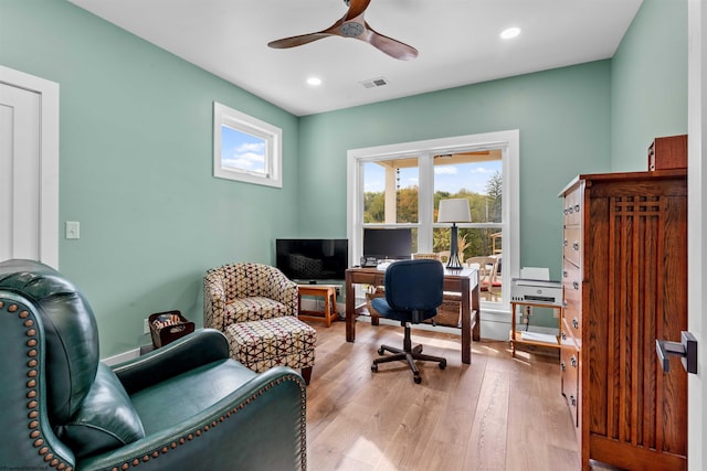 office space with ceiling fan and light wood-type flooring