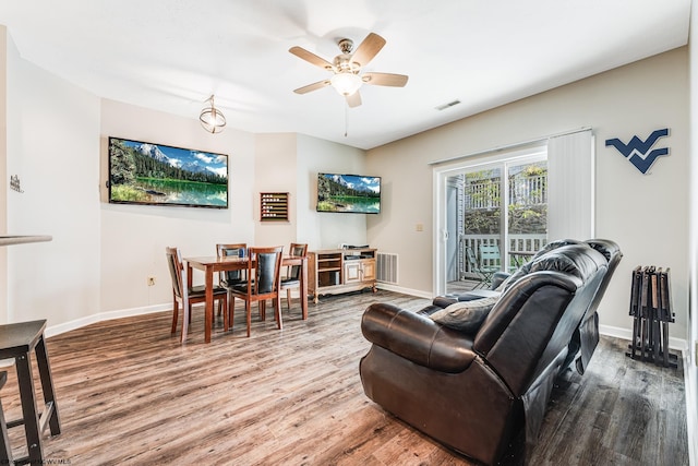 living room with ceiling fan and hardwood / wood-style floors