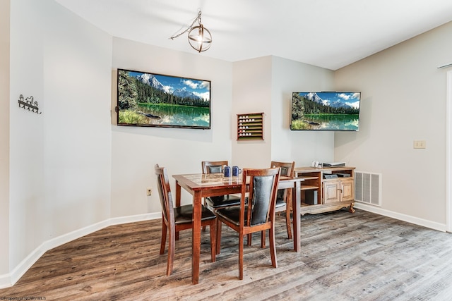 dining room with hardwood / wood-style flooring