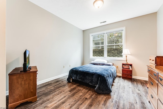 bedroom featuring dark wood-type flooring