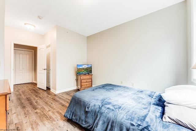 bedroom with light hardwood / wood-style flooring