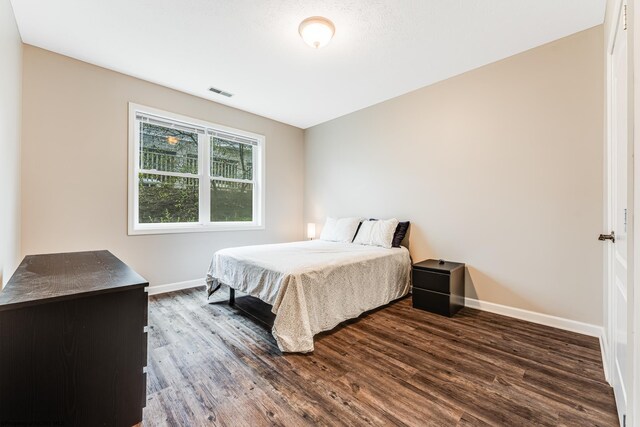 bedroom featuring dark hardwood / wood-style floors