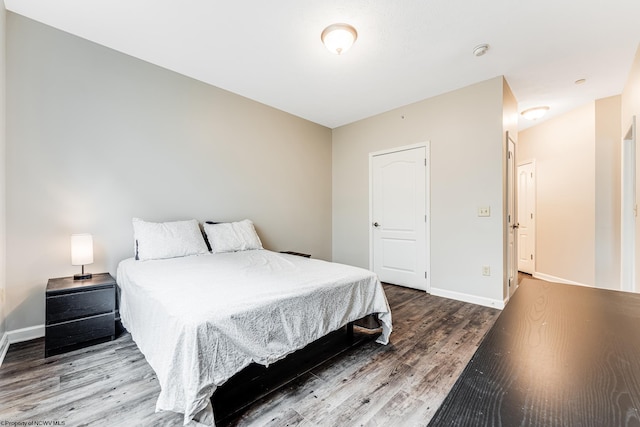 bedroom with hardwood / wood-style floors