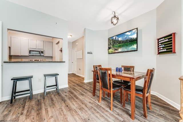 dining area featuring wood-type flooring