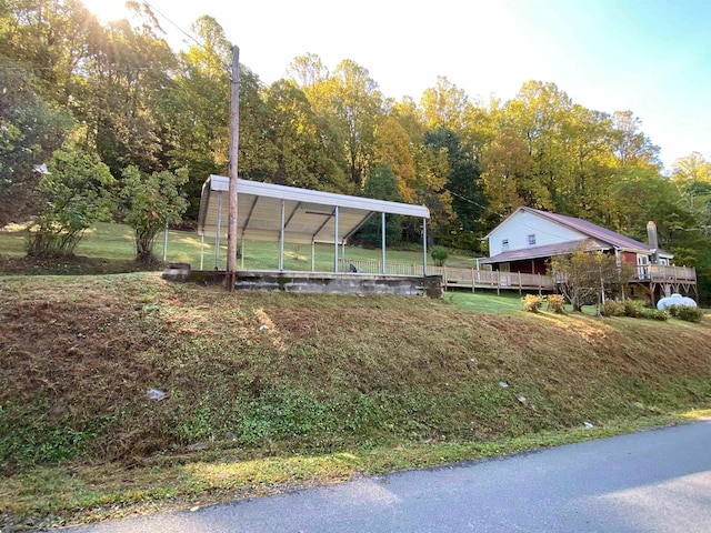 exterior space with a front lawn and a carport