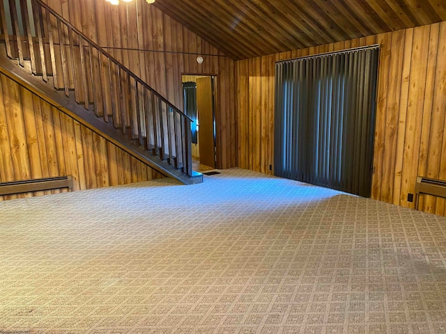 unfurnished living room with wood ceiling, carpet flooring, vaulted ceiling, wooden walls, and baseboard heating