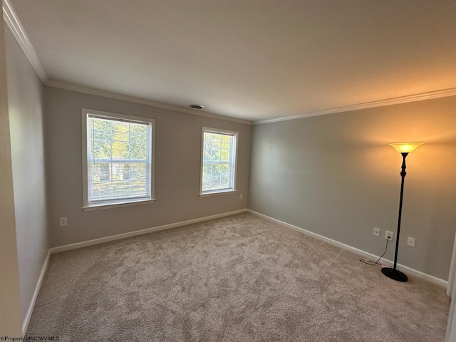 carpeted spare room with ornamental molding