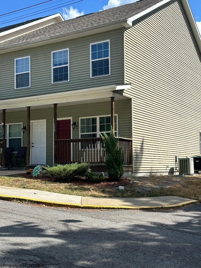 view of front of house with central AC unit and a porch