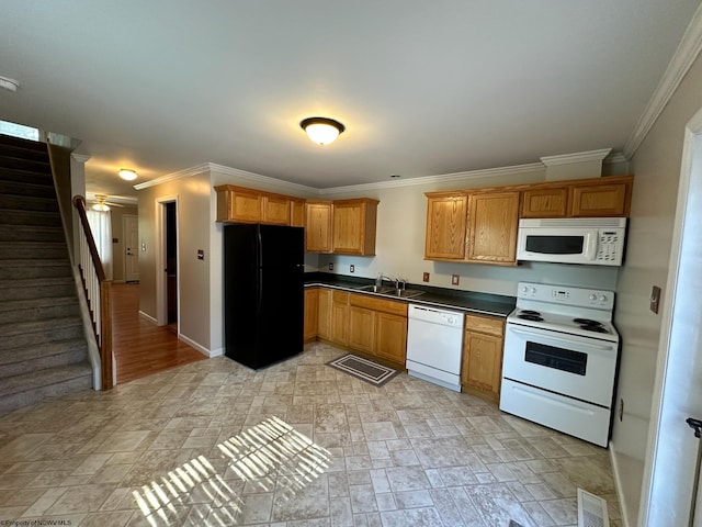 kitchen with crown molding, white appliances, and sink