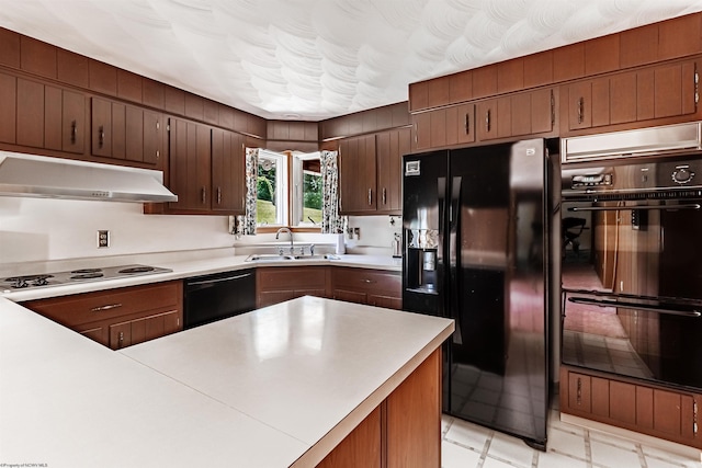 kitchen featuring black appliances and sink