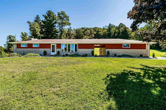 ranch-style home with a front lawn