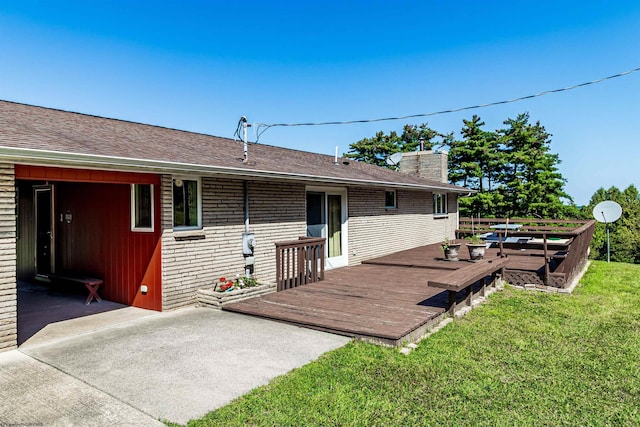 1909 Halleck Rd, Morgantown, WV 26508 - back of property with a deck, brick siding, a shingled roof, a yard, and a chimney