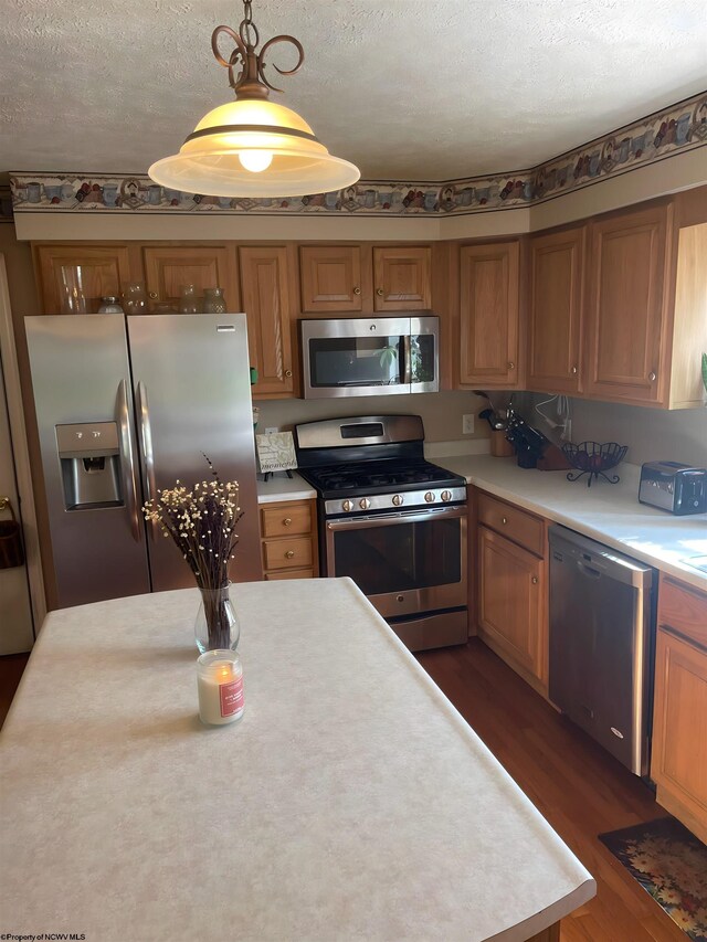 490 Deer Creek Ln, Buckhannon, WV 26201 - kitchen with stainless steel appliances, light countertops, brown cabinetry, and a textured ceiling