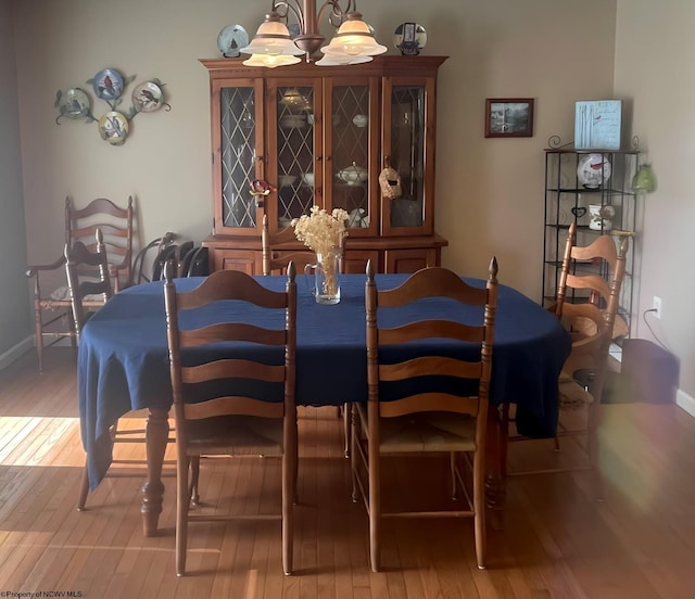 490 Deer Creek Ln, Buckhannon, WV 26201 - dining area with a notable chandelier, hardwood / wood-style flooring, and baseboards
