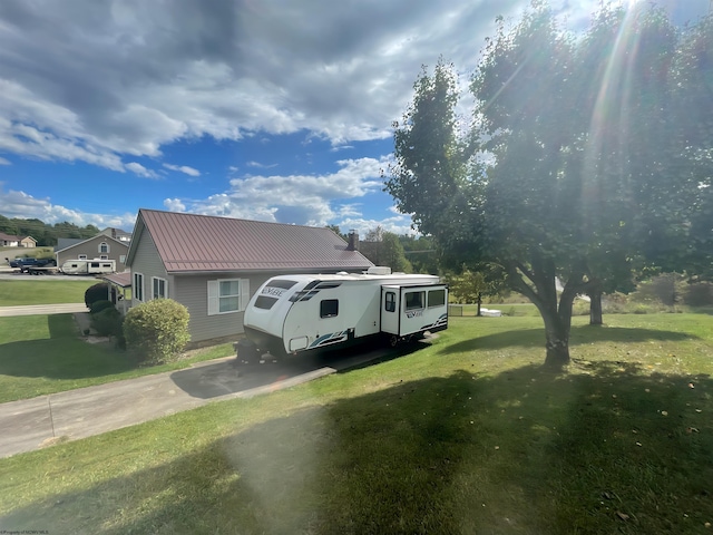 view of side of home featuring a yard