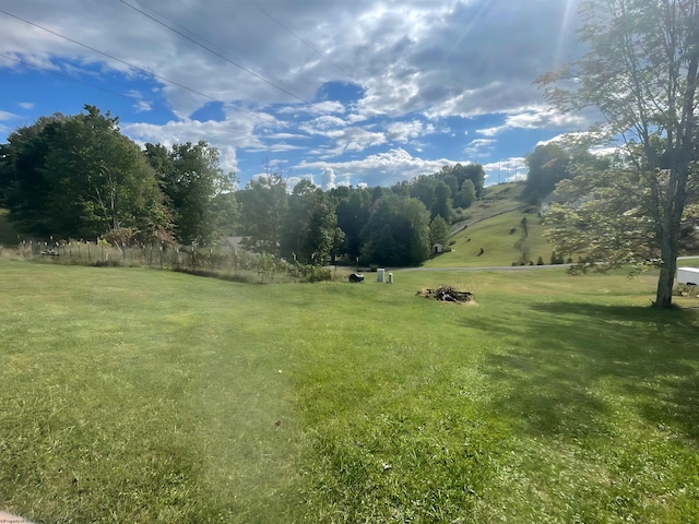 view of yard with a rural view