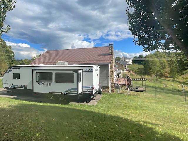 490 Deer Creek Ln, Buckhannon, WV 26201 - exterior space with metal roof, a front yard, and fence