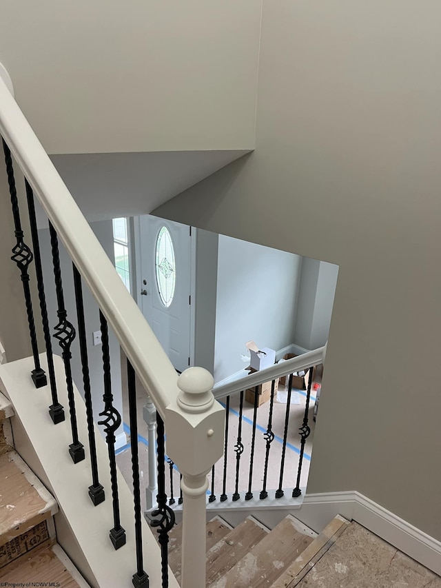 stairway featuring hardwood / wood-style flooring