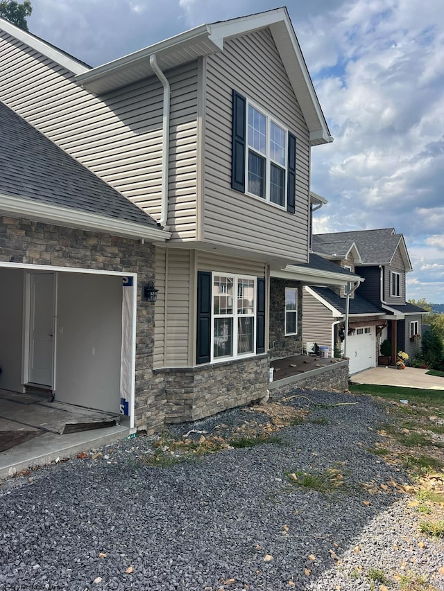 view of property exterior featuring a garage