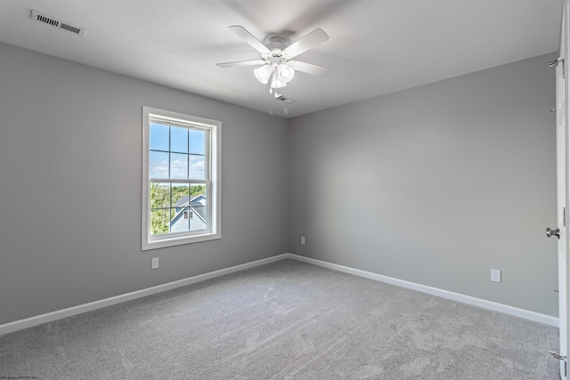 unfurnished room featuring ceiling fan and carpet flooring