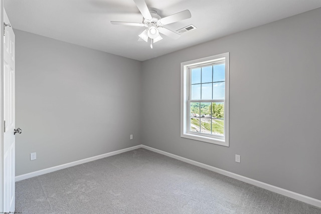 spare room with ceiling fan and carpet flooring