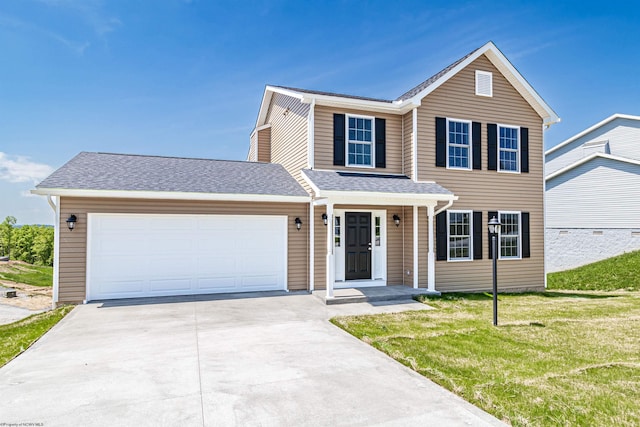 front facade with a garage and a front lawn