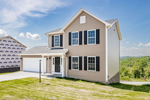 front of property with a front lawn and a garage