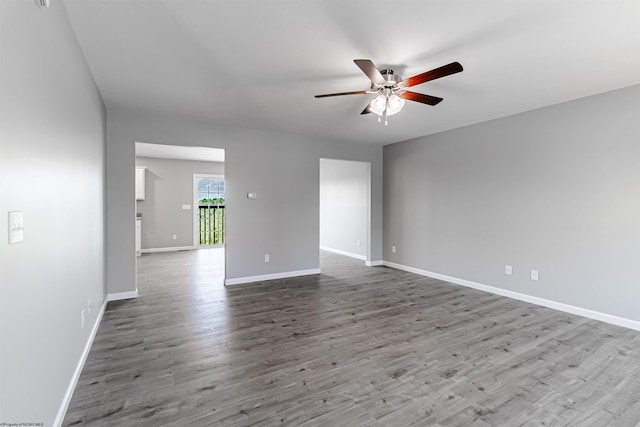 spare room featuring ceiling fan and hardwood / wood-style floors