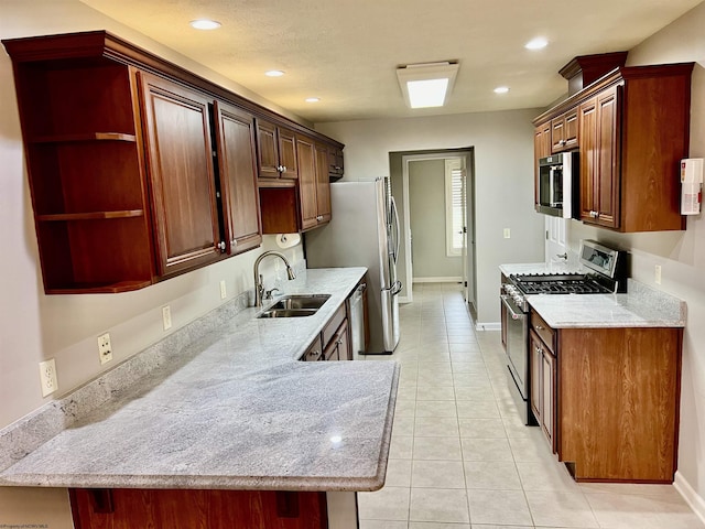 kitchen featuring light tile patterned floors, a sink, open shelves, and stainless steel appliances