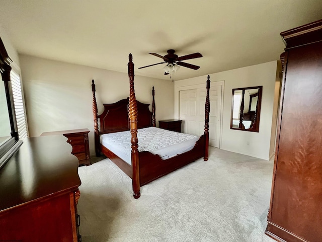 carpeted bedroom with a ceiling fan